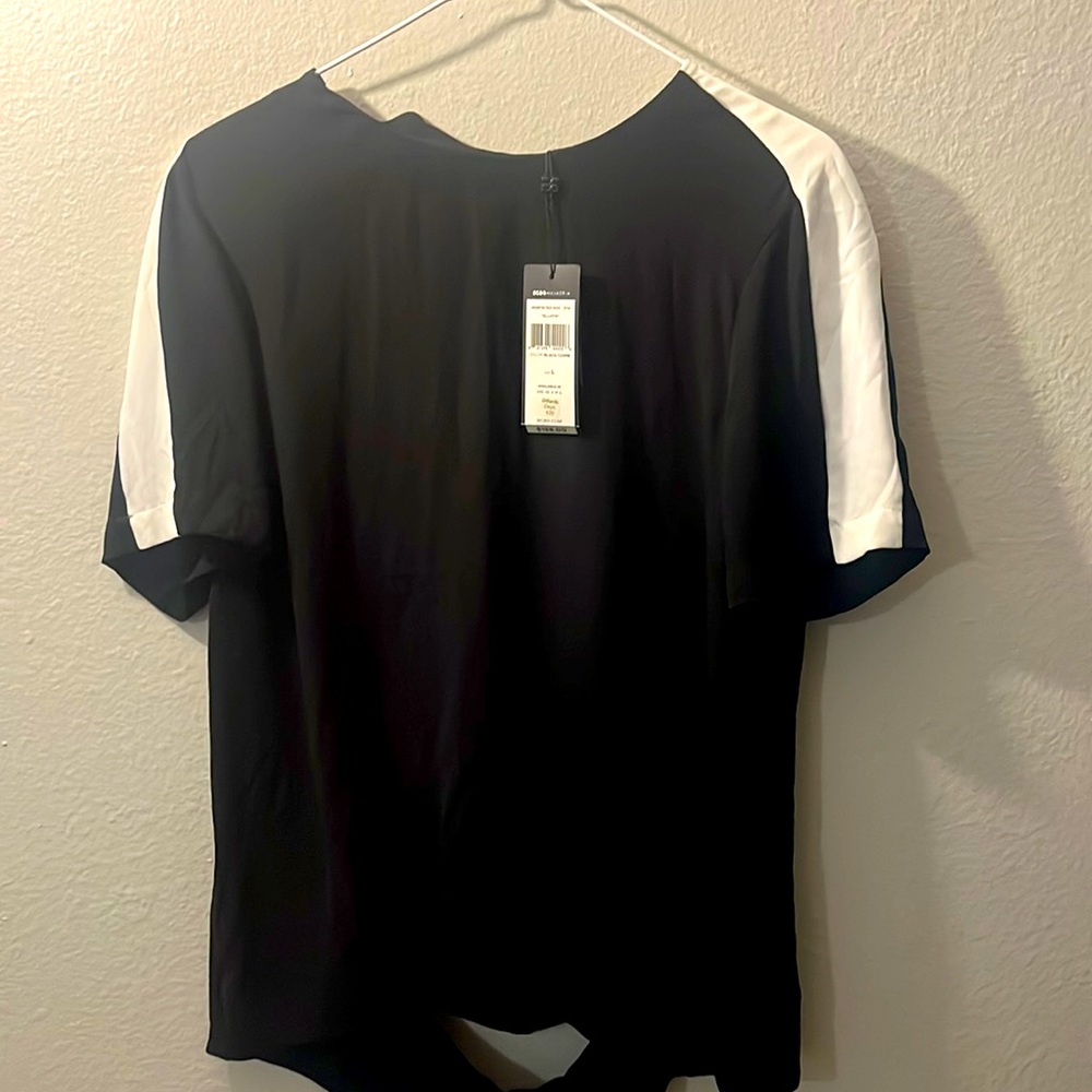 I’m selling a cute black BCBG blouse! Never used!